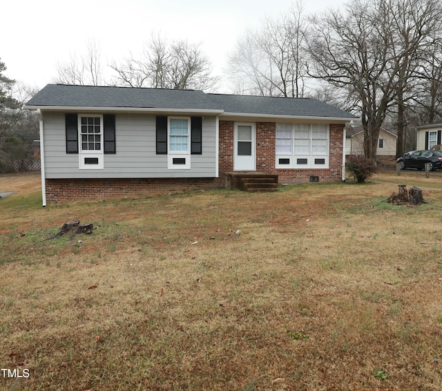 single story home with crawl space and a front yard