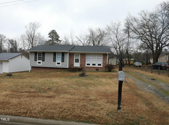 ranch-style home with crawl space, a front lawn, and brick siding