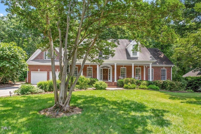 300 Bordeaux Ln, Cary, NC 27511 - new england style home with brick siding, a porch, a front yard, and concrete driveway