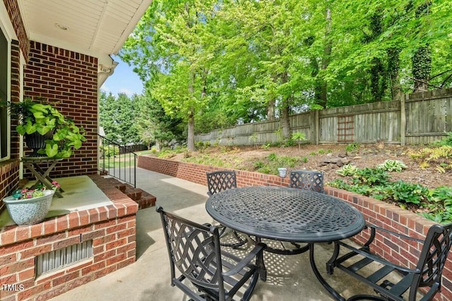 view of patio / terrace with a fenced backyard and outdoor dining area