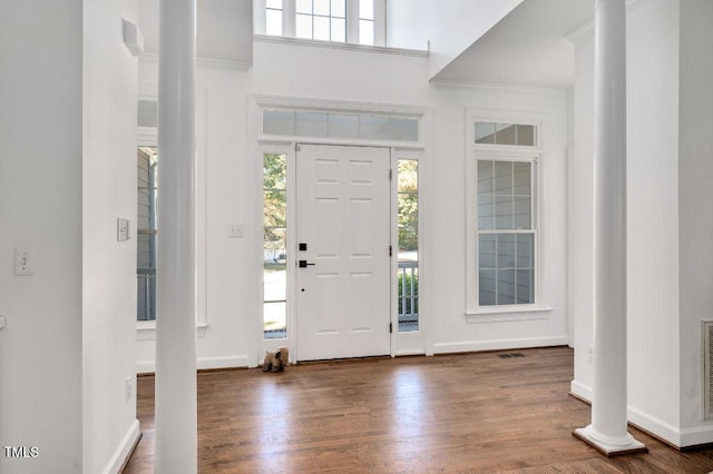 100 Bradborne Cir, Clayton, NC 27520 - entryway featuring baseboards, decorative columns, wood finished floors, and visible vents