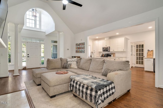 100 Bradborne Cir, Clayton, NC 27520 - living area featuring a ceiling fan, decorative columns, wood finished floors, high vaulted ceiling, and recessed lighting