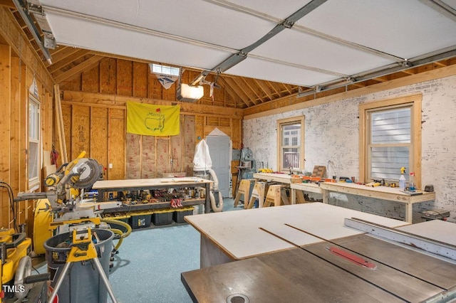 100 Bradborne Cir, Clayton, NC 27520 - garage featuring a workshop area and a garage door opener