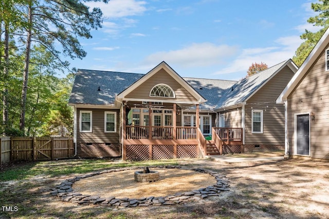 100 Bradborne Cir, Clayton, NC 27520 - rear view of house with fence, a wooden deck, crawl space, a gate, and a fire pit
