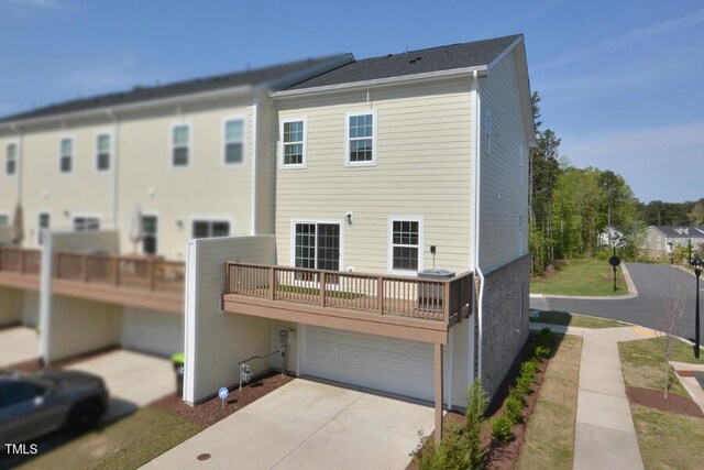 1020 Kentlands Dr, Durham, NC 27713 - rear view of property with an attached garage and concrete driveway