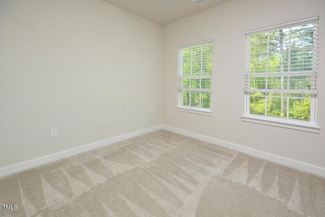 1020 Kentlands Dr, Durham, NC 27713 - unfurnished room featuring visible vents, baseboards, and light colored carpet