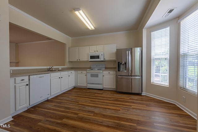 5209 Echo Ridge Rd, Raleigh, NC 27612 - kitchen featuring white appliances, dark wood-type flooring, white cabinetry, and crown molding