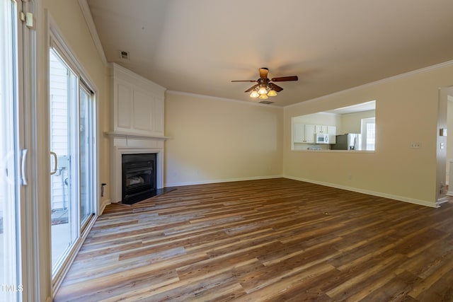 5209 Echo Ridge Rd, Raleigh, NC 27612 - unfurnished living room with wood finished floors, a ceiling fan, baseboards, ornamental molding, and a fireplace