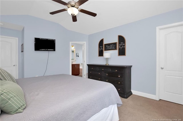 bedroom with lofted ceiling, light carpet, baseboards, ceiling fan, and ensuite bathroom