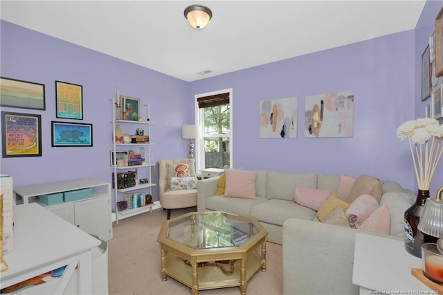living area with light carpet