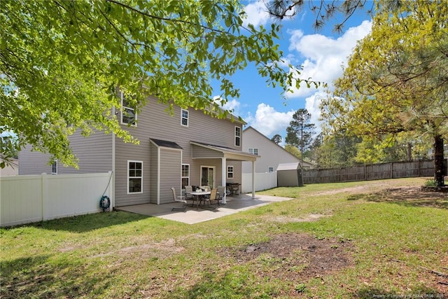back of property with a patio