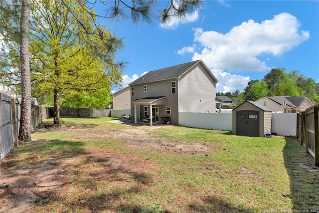 back of house with a storage shed, a patio area, and an outdoor structure
