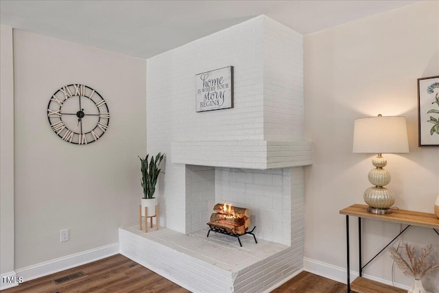 106 Circle Dr, Mebane, NC 27302 - interior space with a fireplace, wood finished floors, visible vents, and baseboards