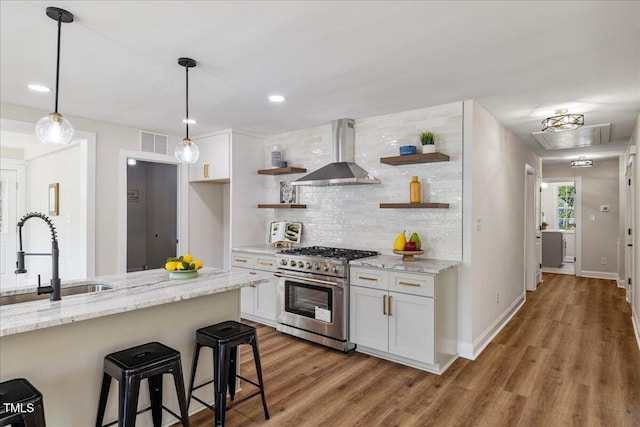 106 Circle Dr, Mebane, NC 27302 - kitchen with wall chimney exhaust hood, a sink, visible vents, open shelves, and high end range