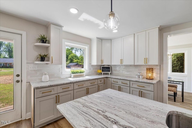 106 Circle Dr, Mebane, NC 27302 - kitchen with tasteful backsplash, open shelves, light wood finished floors, and a healthy amount of sunlight