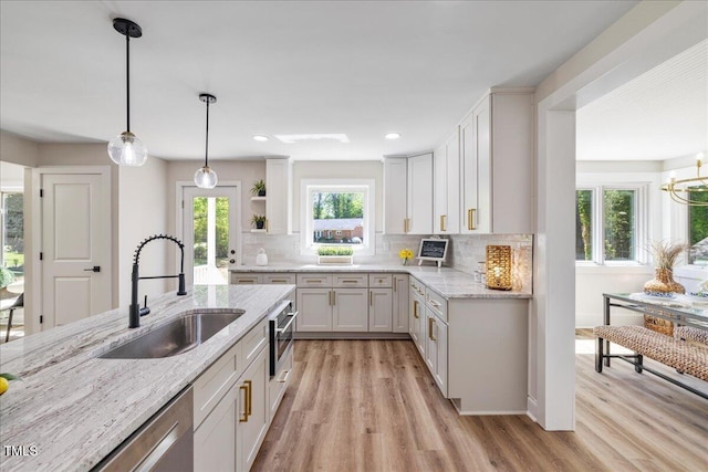 106 Circle Dr, Mebane, NC 27302 - kitchen featuring open shelves, light wood-type flooring, decorative backsplash, and a sink
