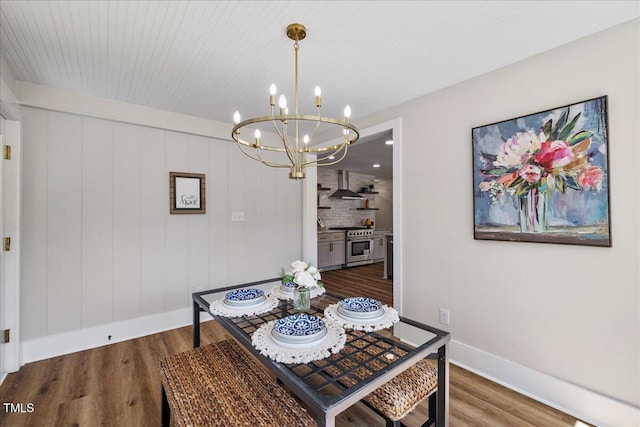 106 Circle Dr, Mebane, NC 27302 - dining area with wood finished floors, baseboards, and a notable chandelier