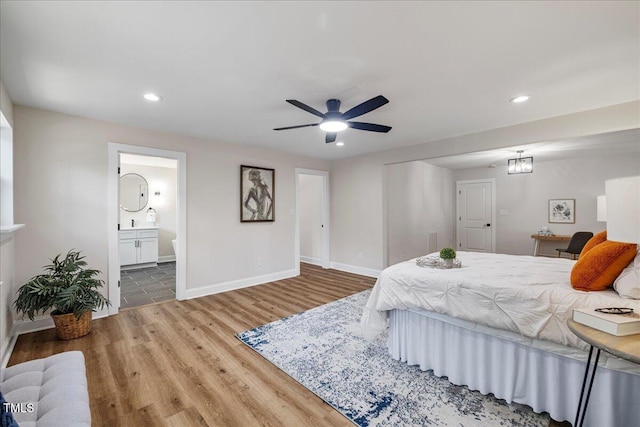 106 Circle Dr, Mebane, NC 27302 - bedroom featuring baseboards, wood finished floors, recessed lighting, and connected bathroom