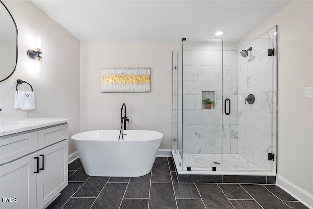 106 Circle Dr, Mebane, NC 27302 - full bathroom featuring recessed lighting, a freestanding bath, vanity, baseboards, and a stall shower