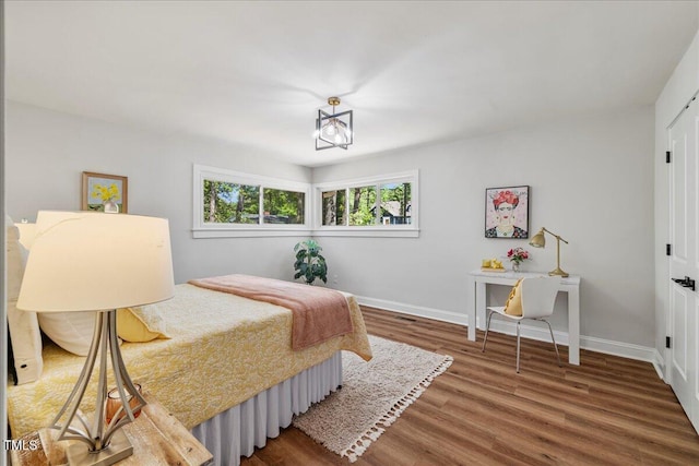 106 Circle Dr, Mebane, NC 27302 - bedroom with baseboards and wood finished floors