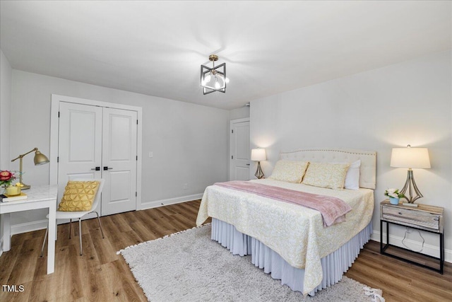 106 Circle Dr, Mebane, NC 27302 - bedroom with wood finished floors, baseboards, and a closet