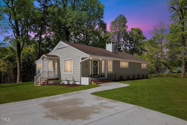 106 Circle Dr, Mebane, NC 27302 - ranch-style house with a lawn and a chimney