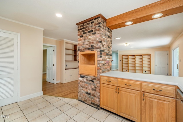 kitchen featuring light tile patterned floors, crown molding, light countertops, recessed lighting, and baseboards