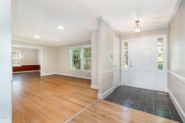 foyer entrance featuring ornamental molding, baseboards, wood finished floors, and recessed lighting