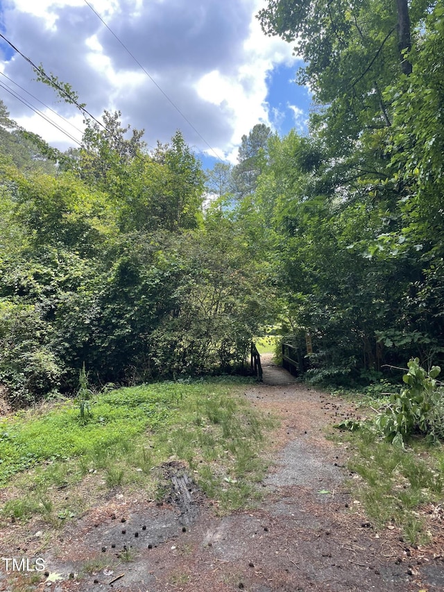view of yard with a wooded view