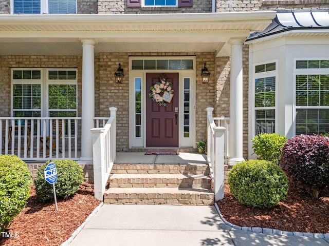 316 Hilliard Forest Dr, Cary, NC 27519 - entrance to property featuring covered porch and mansard roof