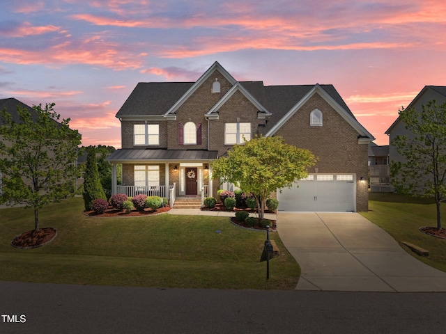 316 Hilliard Forest Dr, Cary, NC 27519 - traditional-style home with a porch, concrete driveway, brick siding, an attached garage, and a front yard