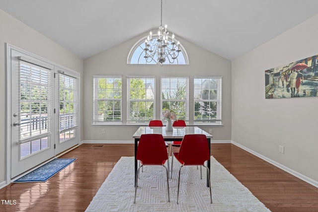 316 Hilliard Forest Dr, Cary, NC 27519 - dining room featuring dark wood finished floors, vaulted ceiling, a chandelier, and baseboards