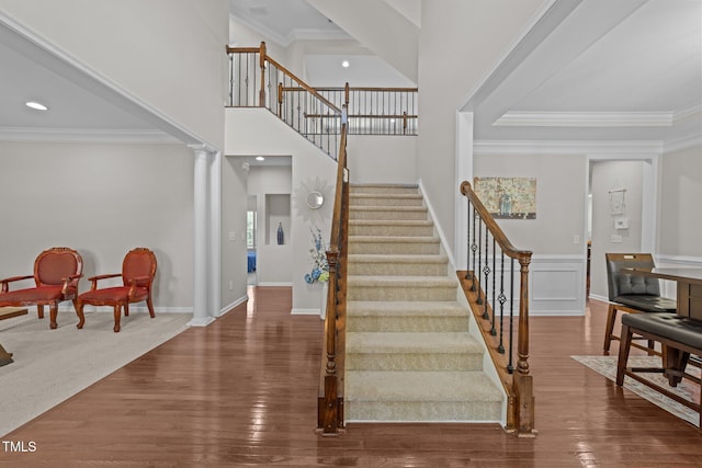 316 Hilliard Forest Dr, Cary, NC 27519 - stairs featuring recessed lighting, wood finished floors, baseboards, and ornamental molding