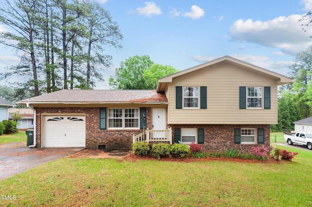 3309 Teal Dr SW, Wilson, NC 27893 - tri-level home featuring an attached garage, aphalt driveway, brick siding, a front lawn, and roof with shingles