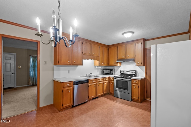 3309 Teal Dr SW, Wilson, NC 27893 - kitchen with baseboards, brick patterned floor, a sink, light countertops, and appliances with stainless steel finishes