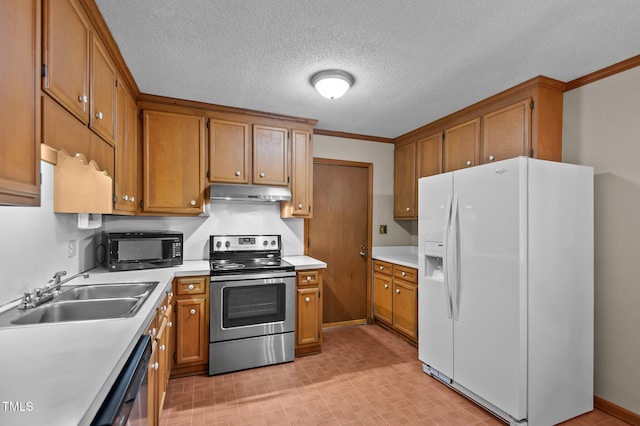 3309 Teal Dr SW, Wilson, NC 27893 - kitchen with a sink, light countertops, under cabinet range hood, brown cabinets, and stainless steel appliances