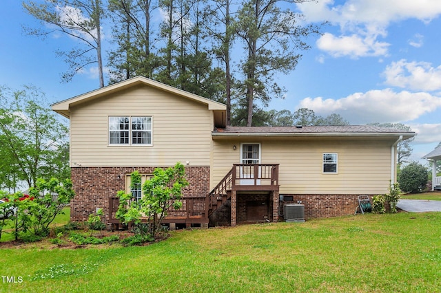 3309 Teal Dr SW, Wilson, NC 27893 - back of property with a wooden deck, central air condition unit, a yard, stairway, and brick siding