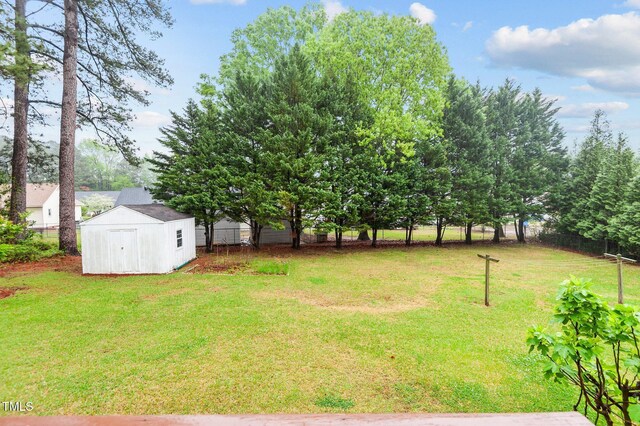 3309 Teal Dr SW, Wilson, NC 27893 - view of yard with a storage unit, fence, and an outdoor structure