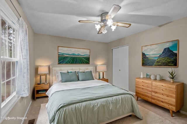 3309 Teal Dr SW, Wilson, NC 27893 - carpeted bedroom with a closet, ceiling fan, baseboards, and visible vents