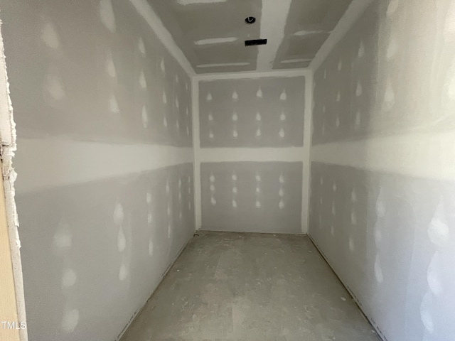 interior space with unfinished concrete flooring
