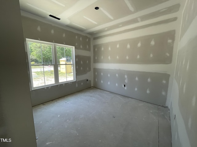 empty room with unfinished concrete floors