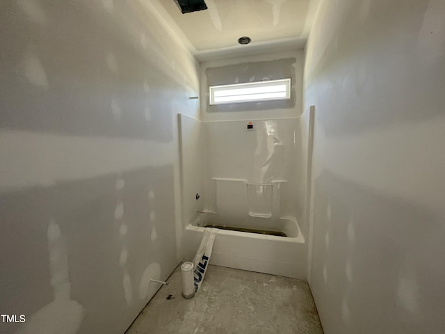 full bath featuring shower / bathing tub combination and unfinished concrete flooring