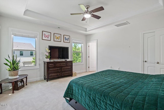 1041 Cotulla Dr, Morrisville, NC 27560 - bedroom featuring visible vents, a raised ceiling, crown molding, and light colored carpet