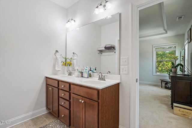 1041 Cotulla Dr, Morrisville, NC 27560 - bathroom featuring a sink, baseboards, and visible vents