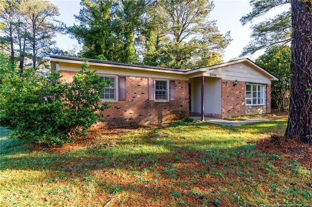 6506 Sprucewood Rd, Fayetteville, NC 28304 - ranch-style home with a front yard and brick siding