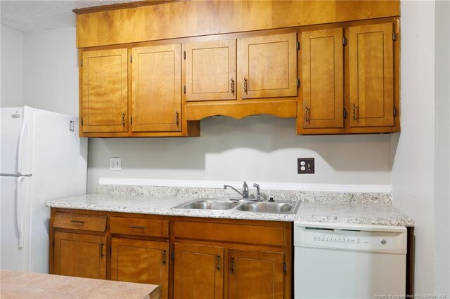 6506 Sprucewood Rd, Fayetteville, NC 28304 - kitchen featuring a sink, brown cabinetry, light countertops, and white appliances