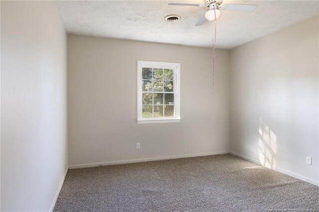6506 Sprucewood Rd, Fayetteville, NC 28304 - carpeted spare room with visible vents, baseboards, a ceiling fan, and a textured ceiling