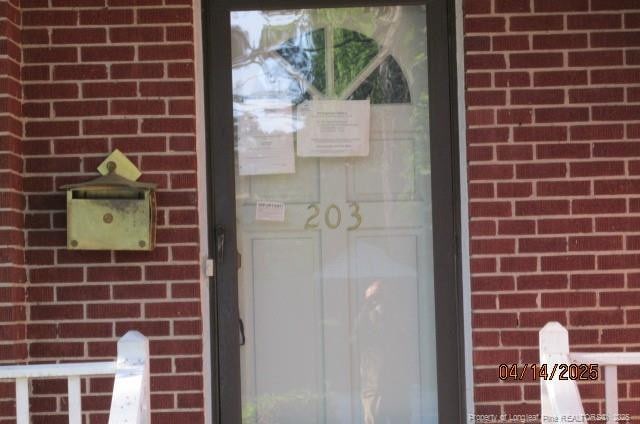 203 W 16th St, Lumberton, NC 28358 - entrance to property with brick siding