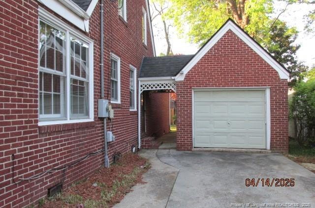 203 W 16th St, Lumberton, NC 28358 - exterior space with brick siding, driveway, and an attached garage