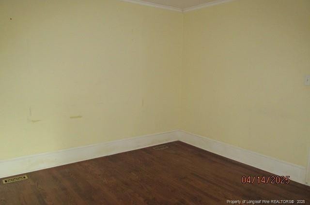 203 W 16th St, Lumberton, NC 28358 - unfurnished room featuring baseboards, crown molding, and wood finished floors